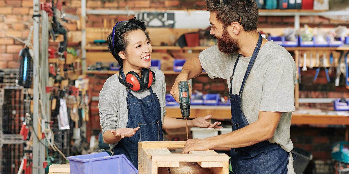 Smiling female carpenter talking to her coworker drilling screws when making wooden drawer Schlagwort(e): Men, Working, People, Occupation, Workshop, Create, Industry, Carpenter, Manual Worker, Male, Female, Box, Standing, Smiling, Skill, Teamwork, Young Adult, Small Business, Caucasian Ethnicity, Wireless Building - Activity, Manufacturing, Carpentry, Craftsperson, Expertise, onstruction Worker, Young Men, Craft, Happiness, Place of Work, Confidence, Equipment, Wood - Material, Work Tool, Coworker, Professional Occupation, Women, Factory, Creativity, Designl, woman, woodwork, job, assembling, drawer, stand, apprentice, helping, positive, Asian, Vietnamese, men, working, people, occupation, workshop, create, industry, carpenter, manual worker, male, female, box, standing, smiling, skill, teamwork, young adult, small business, caucasian ethnicity, wireless building - activity, manufacturing, carpentry, craftsperson, expertise, onstruction worker, young men, craft, happiness, place of work, confidence, equipment, wood - material, work tool, coworker, professional occupation, women, factory, creativity, designl, woman, woodwork, job, assembling, drawer, stand, apprentice, helping, positive, asian, vietnamese