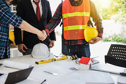 Image of handshake of engineers, designers and business people at room meeting. Schlagwort(e): people, handshake, architect, construction, engineering, professional, teamwork, architecture, designer, contractor, builder, team, agreement, male, businessman, engineer, business, blueprint, worker, meeting, project, work, men, contract, hand, shake, foreman, person, occupation, customer, collaboration, together, desk, plan, safety, successful, cooperation, success, client, corporate, construction industry, handshaking, protective, structural, partner, dealing, expert, greeting, achievement, friendship