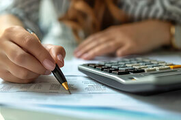 In a close-up view, observe the meticulous work of a tax accountant, diligently managing ledgers, public records, and budgets. The image portrays a dedicated female accounting bookkeeper and clerk, representing the essential roles of bank advisors and auditors in financial management --ar 16:8 --v 6 Job ID: 989541b2-483e-4a85-97be-fd3b55f63e2c Schlagwort(e): business, hand, pen, writing, document, office, paper, businessman, people, closeup, contract, woman, finance, meeting, working, report, work, financial, hands, person, accounting, desk, close-up, table, signing, computer, laptop, keyboard, typing, technology, internet, finger, pc, online, communication, calculator, using, job, information, keypad, notebook, button, fingers, accountant, calculating, money, book, reading, glasses